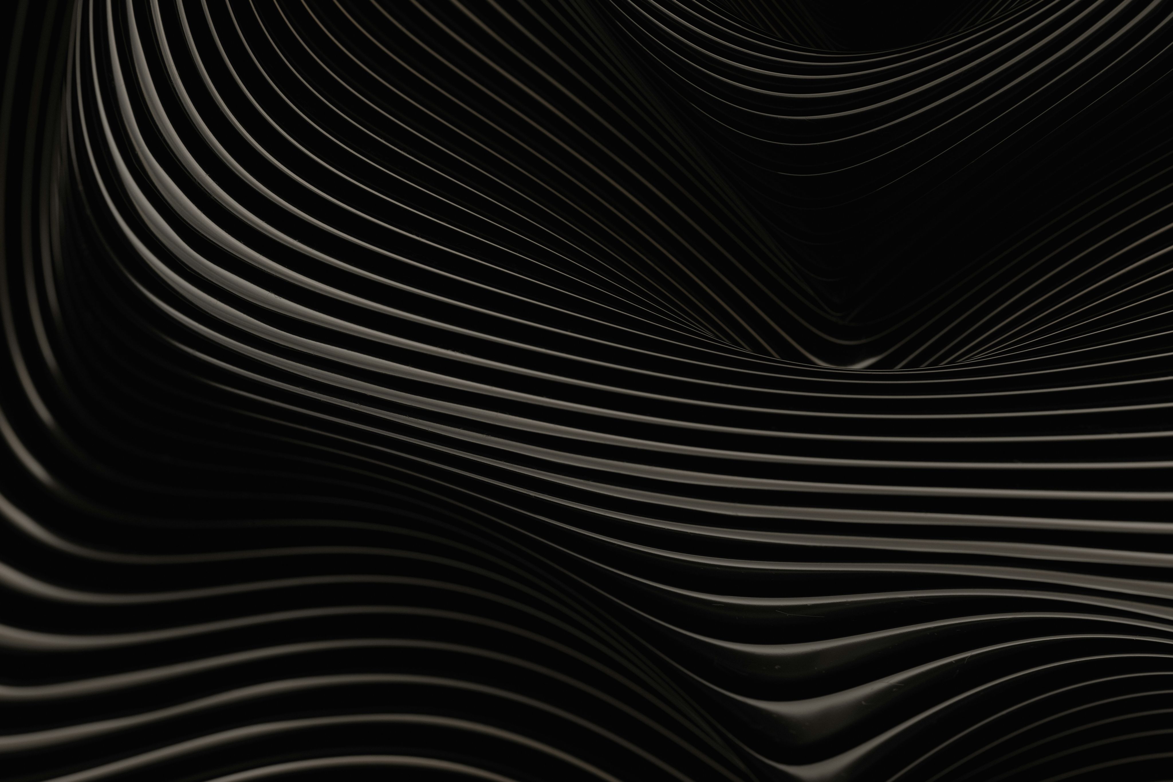 An abstract black and white background with wavy lines