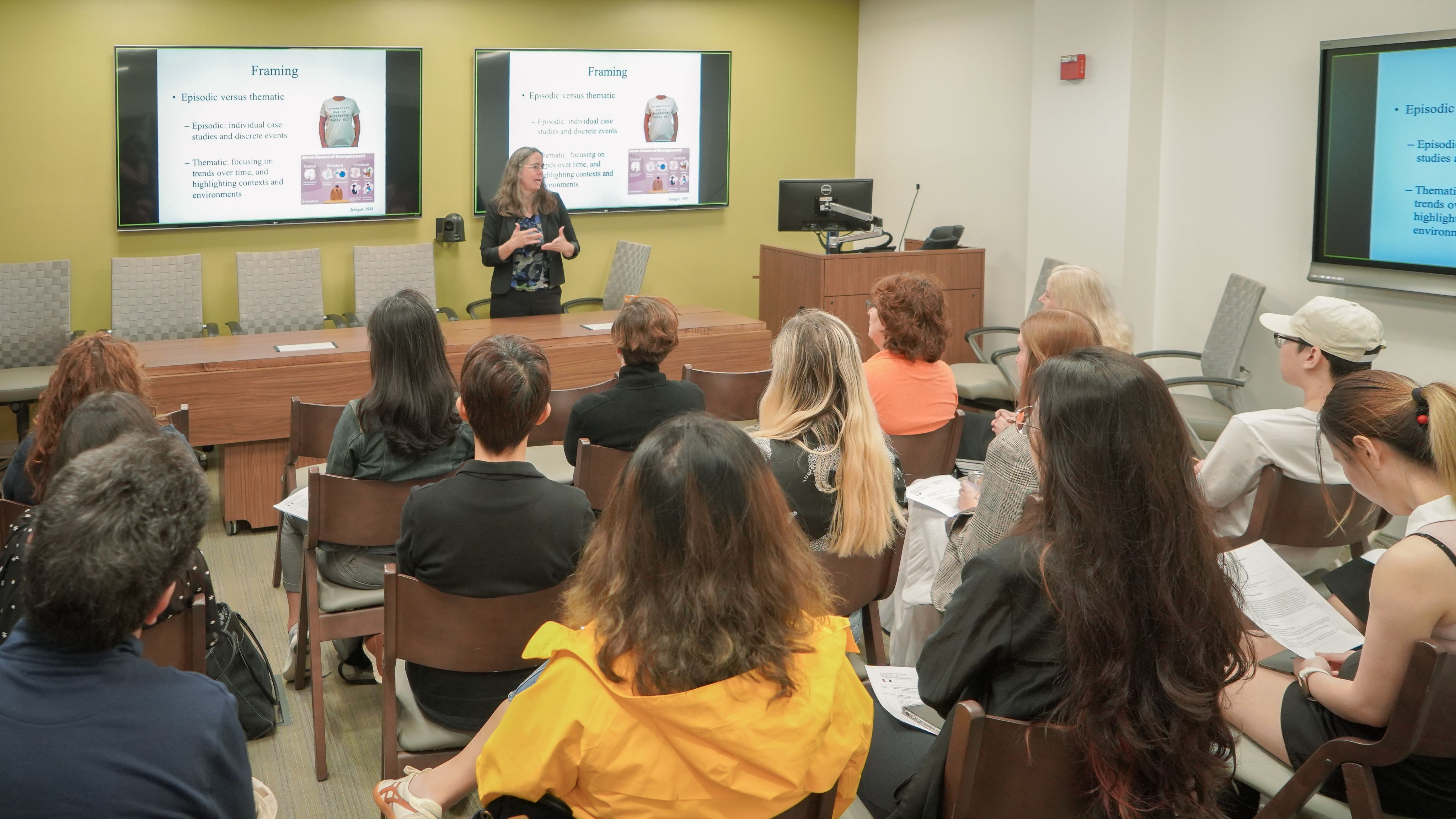 man in white and black checked dress shirt holding white printer paper